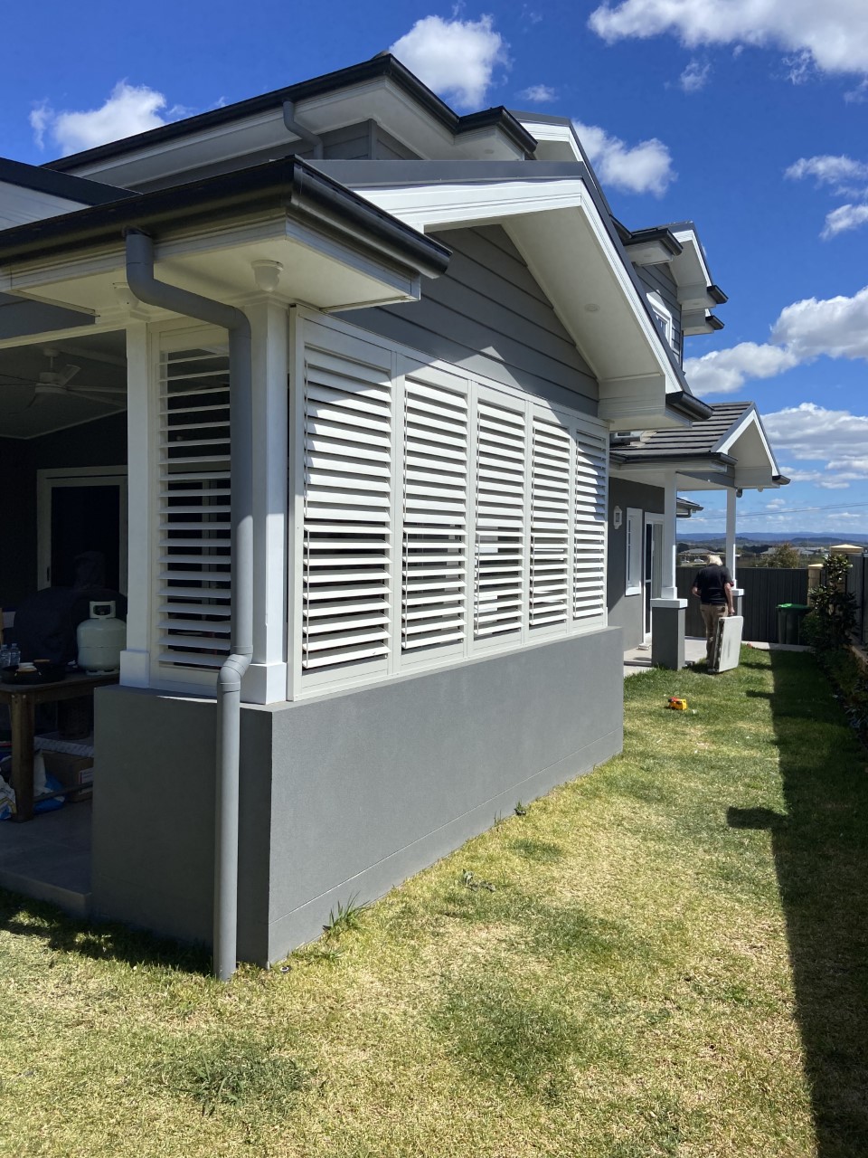 White aluminium shutters on a modern home