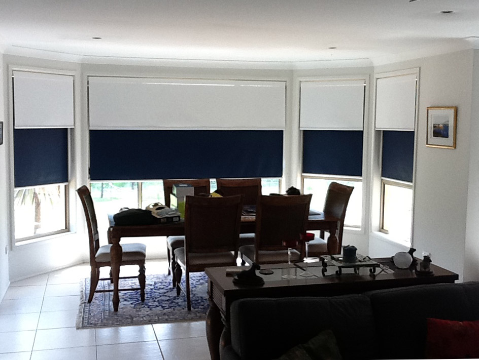 Dining room with dual roller blinds